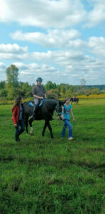 Image of individual riding a horse