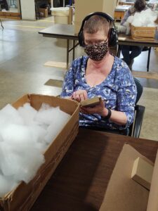 Carla assembling Fairview jewelry boxes for our general labor services