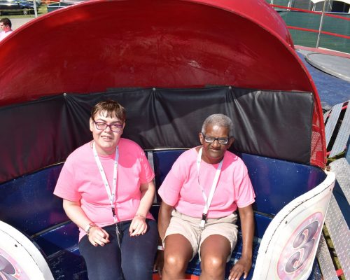 Individuals smiling while on a ride